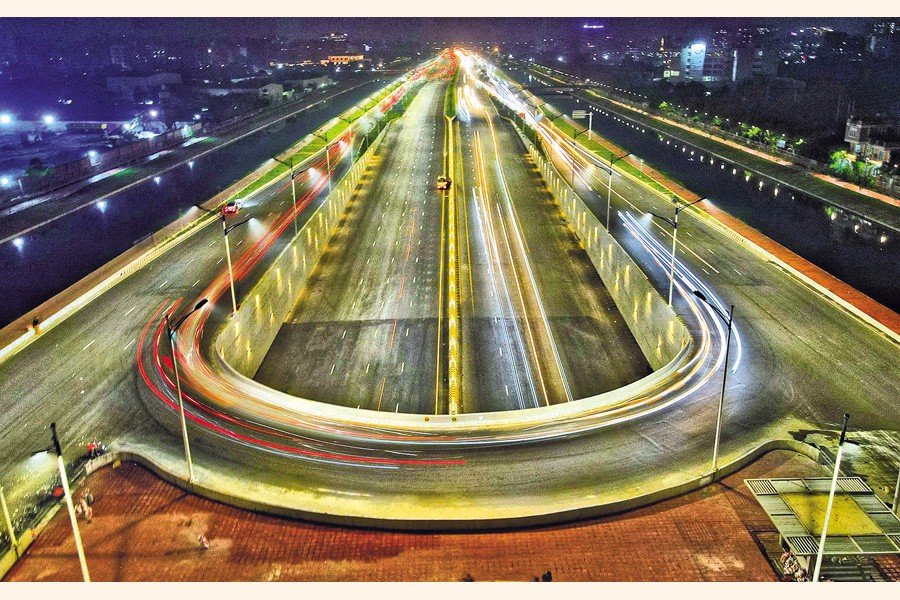Night view of a Dhaka highway interchange.